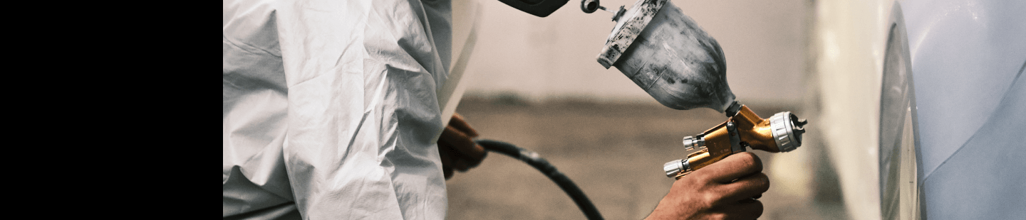 Spray painting car in downdraft booths