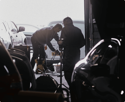 Expert technicians working on car